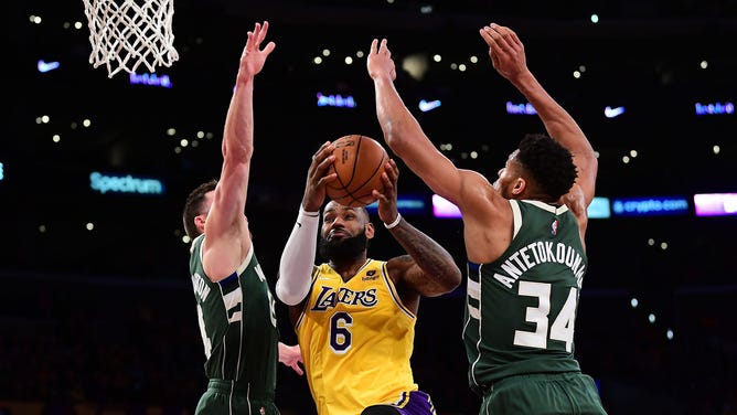 Los Angeles Lakers' LeBron James goes to the basket on Milwaukee Bucks PF Giannis Antetokounmpo (34) and SG Pat Connaughton at Crypto.com Arena. (Gary A. Vasquez-USA TODAY Sports)