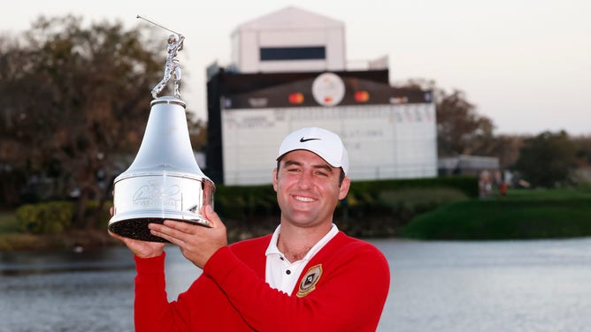 Scottie Scheffler is awarded the championship trophy after winning the Arnold Palmer Invitational 2022 at Bay Hill Club and Lodge. (Reinhold Matay-USA TODAY Sports)