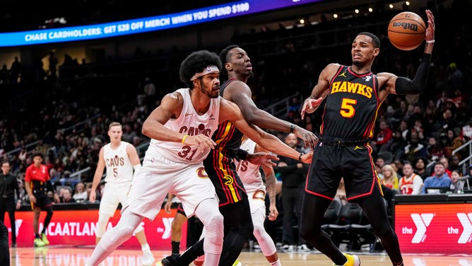 Atlanta Hawks SG Dejounte Murray grabs a rebound vs. the Cleveland Cavaliers at State Farm Arena in Georgia. (Dale Zanine-USA TODAY Sports)
