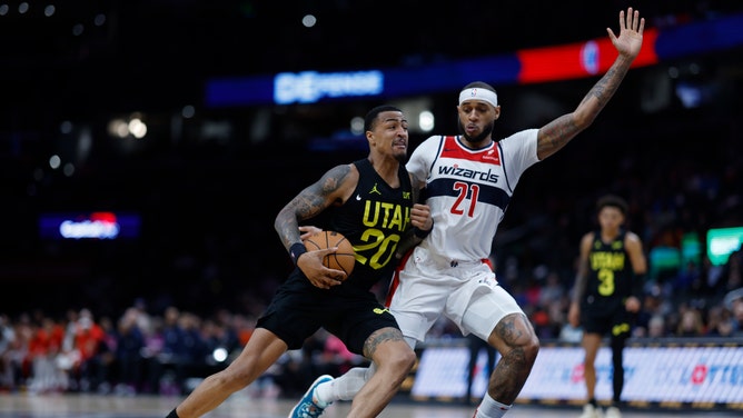 Utah Jazz PF John Collins drives to the basket on former Washington Wizards C Daniel Gafford at Capital One Arena. (Geoff Burke-USA TODAY Sports)