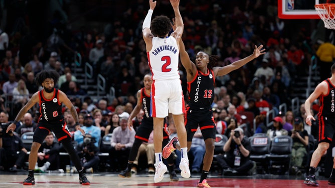 Detroit Pistons PG Cade Cunningham shoots a three Over Chicago Bulls SG Ayo Dosunmu at United Center. (Kamil Krzaczynski-USA TODAY Sports)