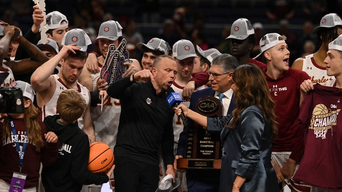 The College of Charleston Cougars getting the trophy after beating the Stony Brook Seawolves in the Coastal Conference tourney title game at Entertainment and Sports Arena. (Tommy Gilligan-USA TODAY Sports)