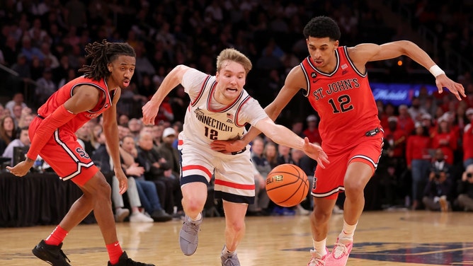 UConn Huskies SG Cam Spencer fights for a loose ball vs. the St. John's Red Storm at Madison Square Garden. (Brad Penner-USA TODAY Sports)
