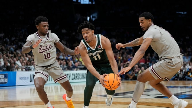 Michigan State Spartans PG A.J. Hoggard (11) drives to the hoop on the Mississippi State Bulldogs in the 2024 NCAA Tournament at the Spectrum Center in North Carolina. (Bob Donnan-USA TODAY Sports)