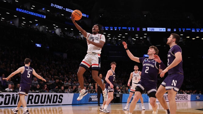 Connecticut Huskies PG Tristen Newton takes a layup vs. the Northwestern Wildcats in the 2024 NCAA Tournament at the Barclays Center. (Brad Penner-USA TODAY Sports)