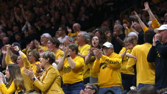 Iowa fans get on their feet as they cheer on the women’s basketball team against West Virginia in a NCAA Tournament round of 32 game Monday, March 25, 2024 at Carver-Hawkeye Arena.