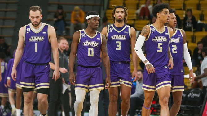 James Madison Dukes players after a timeout during a game against the Southern Miss Golden Eagles. 