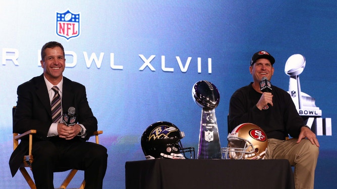 Baltimore Ravens head coach John Harbaugh and San Francisco 49ers head coach Jim Harbaugh speak during a press conference prior to Super Bowl XLVII.