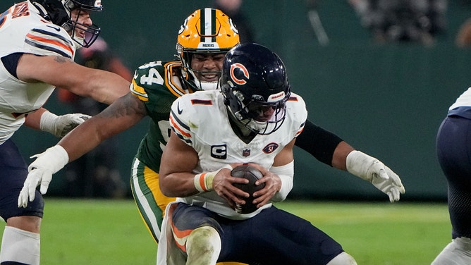 Green Bay Packers defensive end Karl Brooks sacks Chicago Bears quarterback Justin Fields.