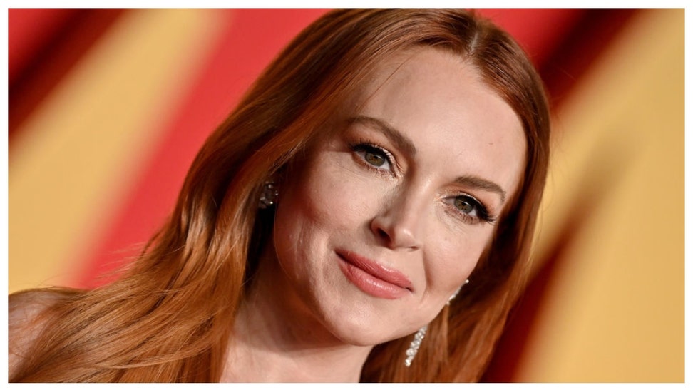 Lindsay Lohan promotes new Netflix movie Irish Wish in revealing dress. 