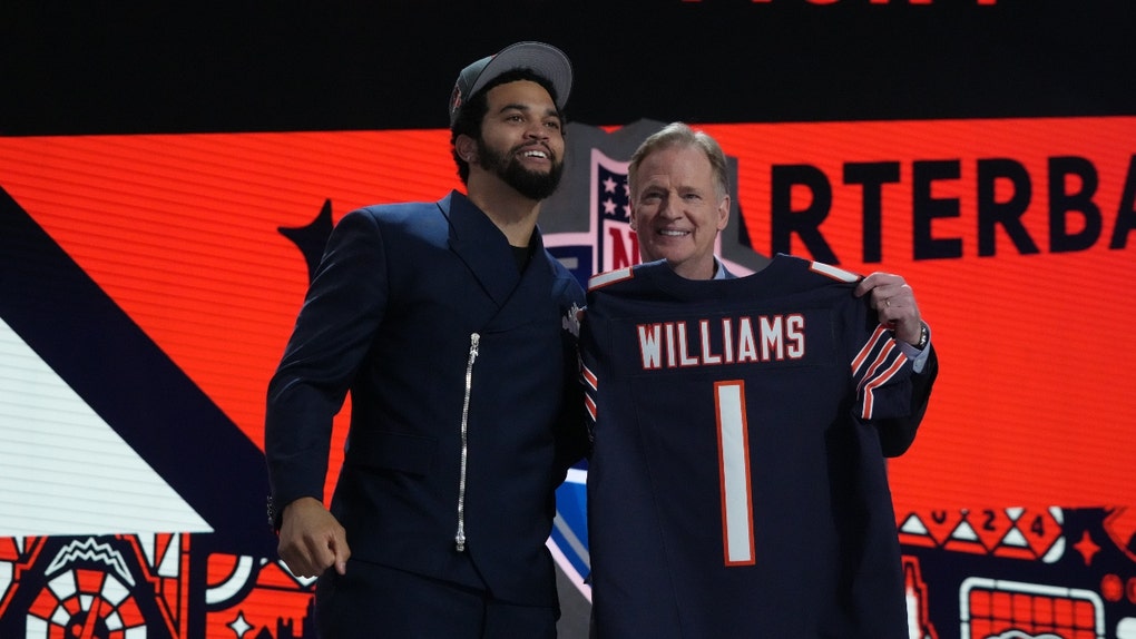 USC Trojans QB Caleb Williams poses with NFL commissioner Roger Goodell after being selected by the Chicago Bears as the No. 1 pick in the 2024 NFL Draft. (Kirby Lee-USA TODAY Sports)