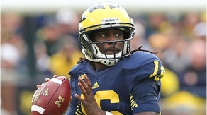 Michigan staffer Denard Robinson has been suspended after being arrested on an OWI charge. (Credit: Getty Images)