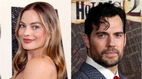 An AI generated fake James Bond trailer has people thinking Henry Cavill and Margot Robbie will star in a new movie. It's not true. Watch the video. (Credit: Getty Images)