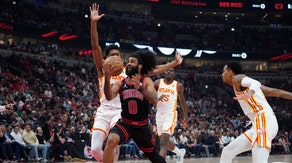 Chicago Bulls SG Coby White blows past Atlanta Hawks SF De'Andre Hunter a play-in game for the 2024 NBA playoffs at United Center in Illinois. (David Banks-USA TODAY Sports)