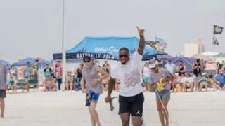Alabama quarterback Jalen Milroe throws a mullet 94-feet on Saturday at the Flora-Bama lounge 

Courtesy of C-Shelz Photography