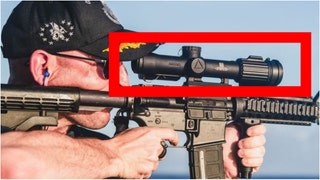 Was the Navy's embarrassing rifle photo actually photoshopped and edited? A photo expert believes the backwards optic was added after the fact. (Credit: Navy)