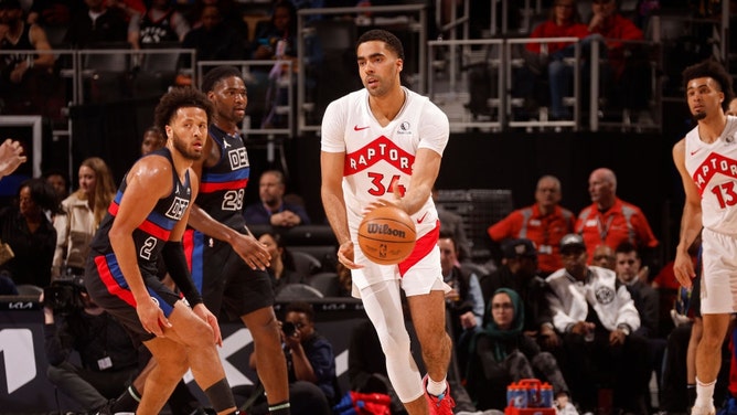 Former Toronto Raptors forward Jontay Porter looks to hand off the ball during a game vs. the Detroit Pistons at Little Caesars Arena in Michigan. (Photo by Brian Sevald/NBAE via Getty Images)