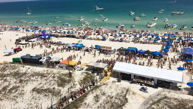 Alabama quarterback Jalen Milroe throws a mullet 94-feet on Saturday at the Flora-Bama lounge Courtesy of C-Shelz Photography