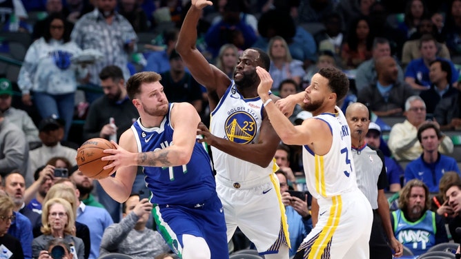 Dallas Mavericks All-Star Luka Doncic looks to pass with Golden State Warriors PF Draymond Green and Stephen Curry double teaming him at American Airlines Center. (Kevin Jairaj-USA TODAY Sports)