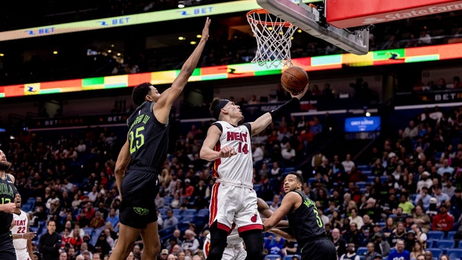 Miami Heat SG Tyler Herro drives to the basket on New Orleans Pelicans SF Trey Murphy III at Smoothie King Center in Louisiana. (Stephen Lew-USA TODAY Sports)