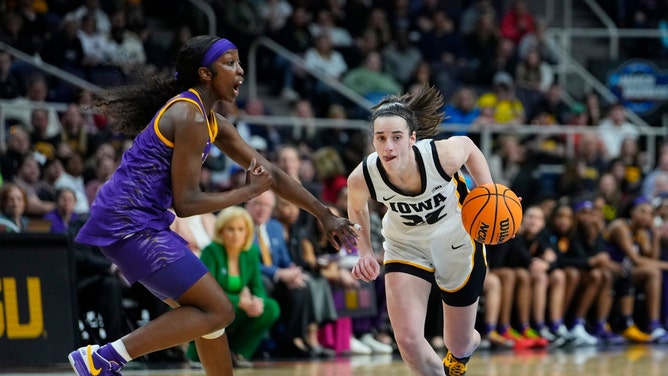 Iowa Hawkeyes superstar Caitlin Clark drives to the hole on LSU Lady Tigers guard Flau'jae Johnson in the 2024 NCAA Tournament at MVP Arena in Albany, New York. (Gregory Fisher-USA TODAY Sports)