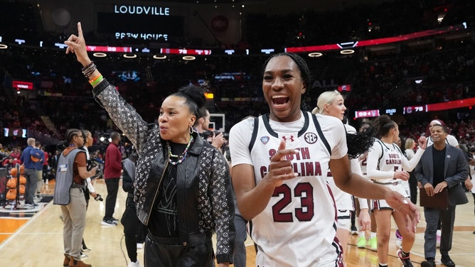 South Carolina Gamecocks head coach Dawn Staley and guard Bree Hall celebrate after defeating the NC State Wolfpack in the Final Four of the women's 2024 NCAA Tournament at Rocket Mortgage FieldHouse. (Kirby Lee-USA TODAY Sports)