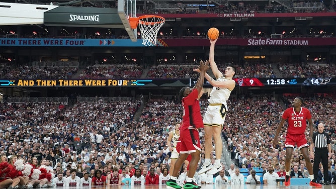 Purdue Boilermakers C Zach Edey shoots over NC State Wolfpack big DJ Burns Jr. in the men's Final Four of the 2024 NCAA Tournament at State Farm Stadium. (Robert Deutsch-USA TODAY Sports)