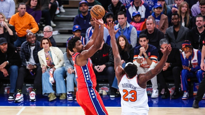 Philadelphia 76ers C Joel Embiid shoots over New York Knicks C Mitchell Robinson in Game 1 in their 1st-round 2024 NBA playoffs series at Madison Square Garden. (Wendell Cruz-USA TODAY Sports)