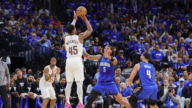 Cleveland Cavaliers All-Star Donovan Mitchell shoots over Orlando Magic All-Star Paolo Banchero in the 2nd half of Game 3 of the 1st round for the 2024 NBA playoffs at Kia Center in Florida. (Mike Watters-USA TODAY Sports)
