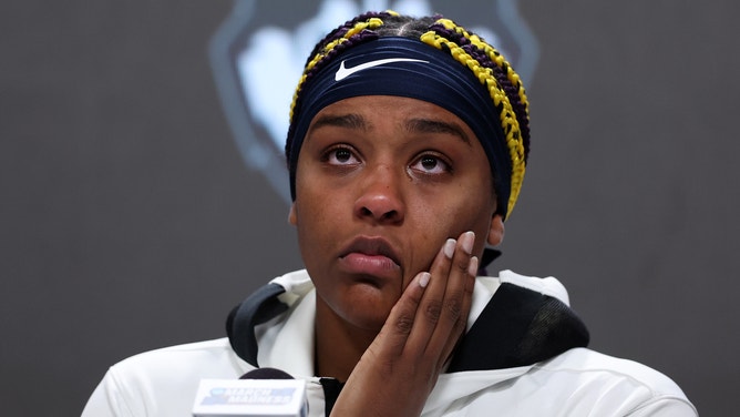 Aaliyah Edwards of the UConn Huskies gets emotional while speaking to the media after losing to the Iowa Hawkeyes in the NCAA Women's Basketball Tournament Final Four.
