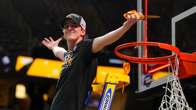 Iowa Hawkeyes guard Caitlin Clark cuts the net after defeating the LSU Tigers in the finals of the Albany Regional in the 2024 NCAA Tournament at MVP Arena.