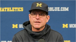 Jim Harbaugh left Michigan, in part, over trust issues with AD Warde Manuel, according to a new book. (Credit: Getty Images)