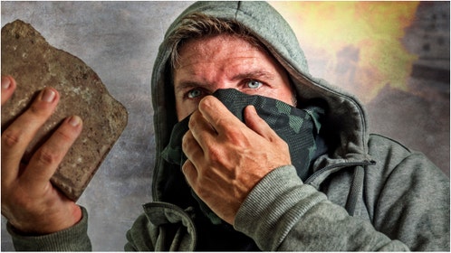 Antifa attacked a fellow occupier at the University of Washington. Watch a video of the situation. (Credit: Getty Images)