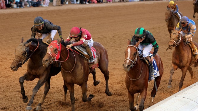 Mystik Dan crosses the finish line ahead of Sierra Leone and Forever Young in the 150th running of the Kentucky Derby at Churchill Downs in Louisville. (Photo: Michael Reaves/Getty Images)
