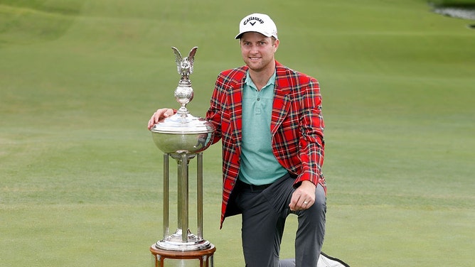 Chris Kirk poses with the Leonard trophy after winning the 2015 Charles Schwab Challenge, formerly known as Crowne Plaza Invitational, at the Colonial Country Club in Fort Worth, Texas. (Scott Halleran/Getty Images)