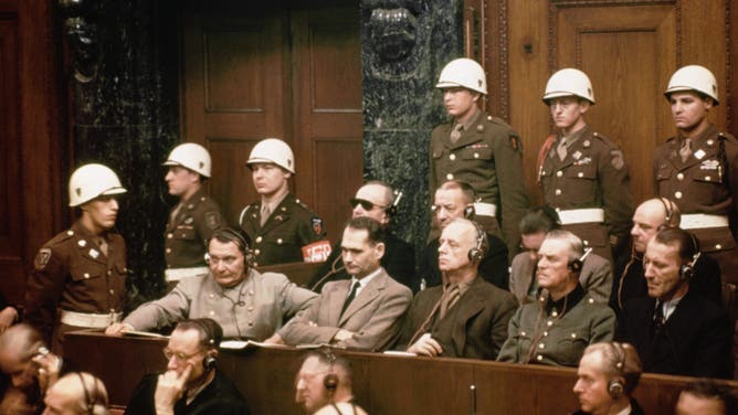 The defendants at the Nuremberg Nazi trials. Pictured in the front row are: Hermann Goering, Rudolf Hess, Joachim Von Ribbentrop, Wilhelm Keitel and Ernst Kaltenbrunner. In the back row are: Karl Doenitz, Erich Raeder, Baldur von Schirach, and Fritz Sauckel. (Credit: Getty Images)