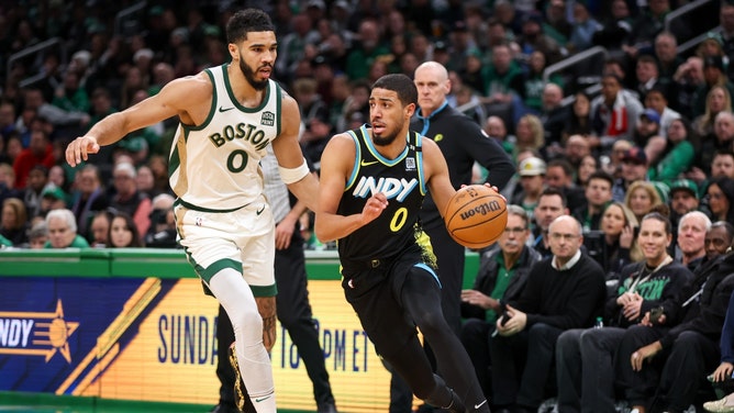 Indiana Pacers PG Tyrese Haliburton dribbles past Celtics SF Jayson Tatum at TD Garden in Boston. (Paul Rutherford-USA TODAY Sports)