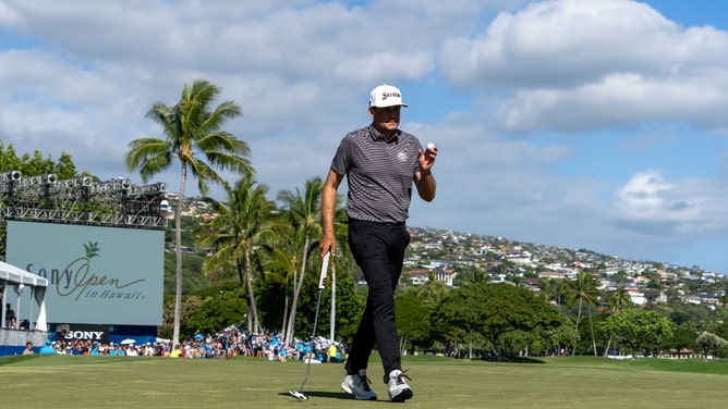 Keegan Bradley waves to the crowd after making a putt on the 18th hole during the Round 4 of the 2024 Sony Open in at Waialae Country Club in Hawaii. (Kyle Terada-USA TODAY Sports)