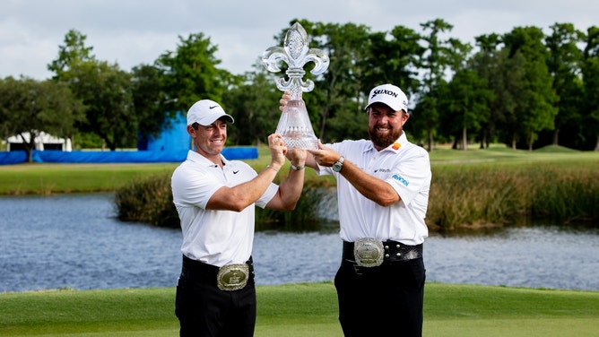 Rory McIlroy and Shane Lowry pose for fans and the media after winning the 2024 Zurich Classic of New Orleans. (Stephen Lew-USA TODAY Sports)