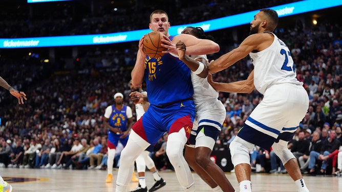 Nuggets C Nikola Jokic gets double-teamed by Minnesota Timberwolves bigs Naz Reid and Rudy Gobert in Game 1 of the 2nd round of the 2024 NBA Playoffs at Ball Arena in Denver. (Ron Chenoy-USA TODAY Sports)