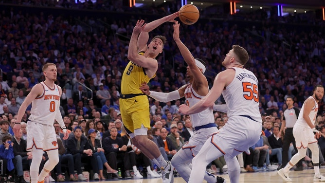 Indiana Pacers PG T.J. McConnell passes the ball in traffic against the New York Knicks during the 2024 NBA Playoffs at Madison Square Garden. (Brad Penner-USA TODAY Sports)