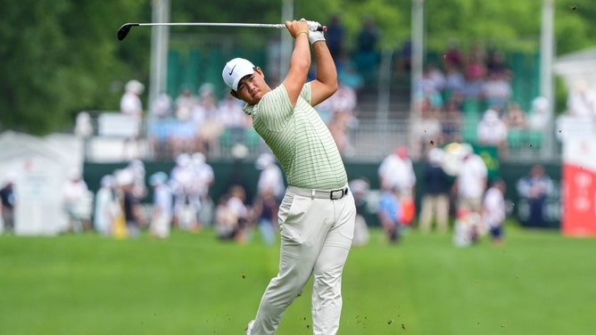 Tom Kim hits from the fairway at the tenth hole during the second round of the Wells Fargo Championship at Quail Hollow Club in Charlotte, North Carolina. (Jim Dedmon-USA TODAY Sports)