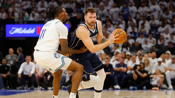 Timberwolves PF Naz Reid defends Mavericks All-Star Luka Doncic Wednesday in the Western Conference of the 2024 NBA Playoffs at Target Center in Minnesota. (Bruce Kluckhohn-USA TODAY Sports)