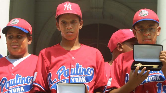The Rolando Paulino All-Stars Bronx Little League baseball team had to vacate all of its wins in the 2001 Little World Series when it was discovered that Danny Almonte (center) was actually 14 years old, two years older than the rules allowed.