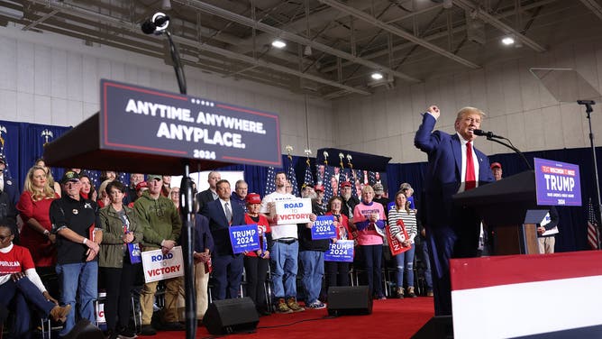 Former President Donald Trump speaks to guests at a rally on April 02, 2024 in Green Bay, Wisconsin. At the rally Trump spoke next to an empty lectern on the stage and challenged President Joe Biden to debate him.