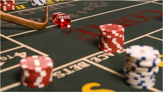 A man is going viral for flipping out at a casino at a craps table. Watch the crazy video. What sparked the chaos? Where did it happen? (Credit: Getty Images)