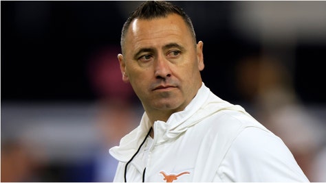 Texas football coach Steve Sarkisian surprised kicker Bert Auburn with a scholarship. Watch a heartwarming video of the situation. (Credit: Getty Images)