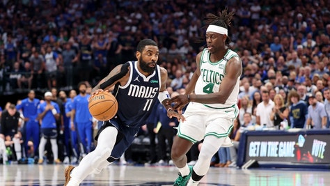 Dallas Mavericks SG Kyrie Irving drives to the point on Boston Celtics PG Jrue Holiday in Game 3 of the 2024 NBA Finals at American Airlines Center. (Kevin Jairaj-USA TODAY Sports)