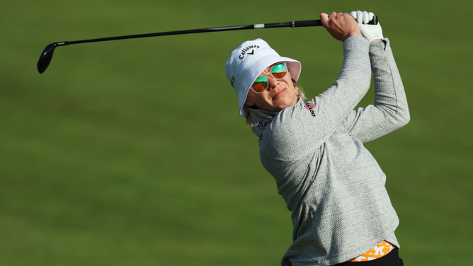 LPGA Golfer Smokes A Camera Guy In The Head With Shot