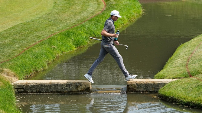 Keegan Bradley crosses the creek as he walks to the 14th green during the third round of the 2023 Memorial. (Adam Cairns/Columbus Dispatch/USA TODAY NETWORK)